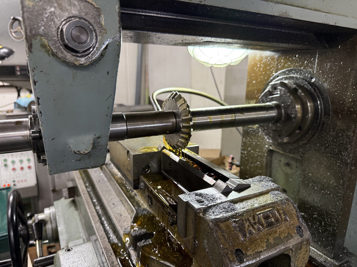 Tosho Seiko factory — precision cutting with cooling oil