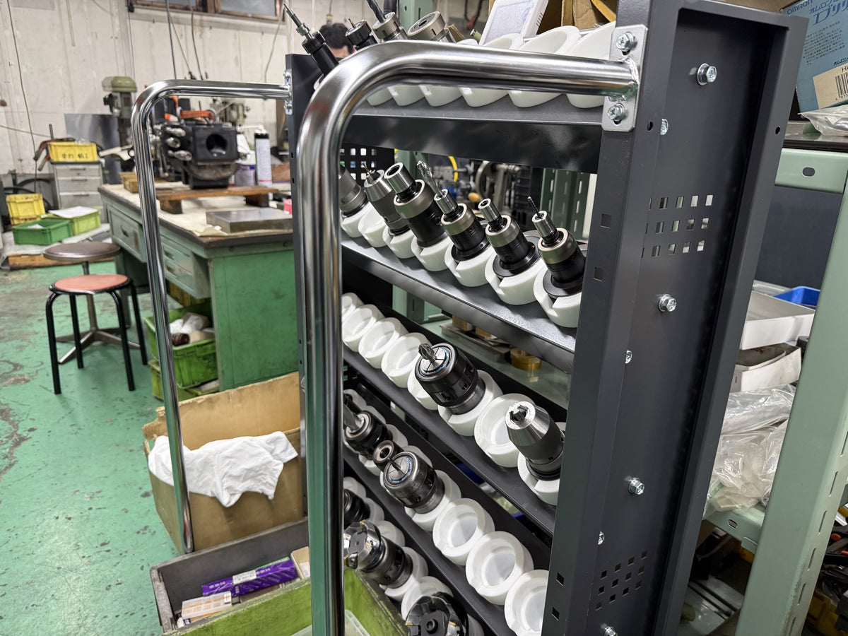 Tosho Seiko factory — tool holders arranged on a rack