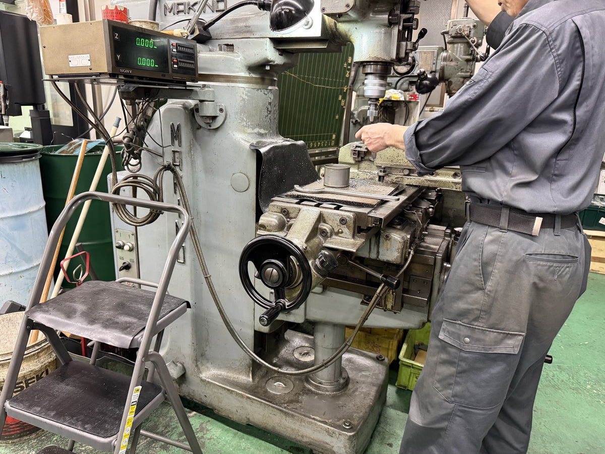 Tosho Seiko factory — workbench and machining